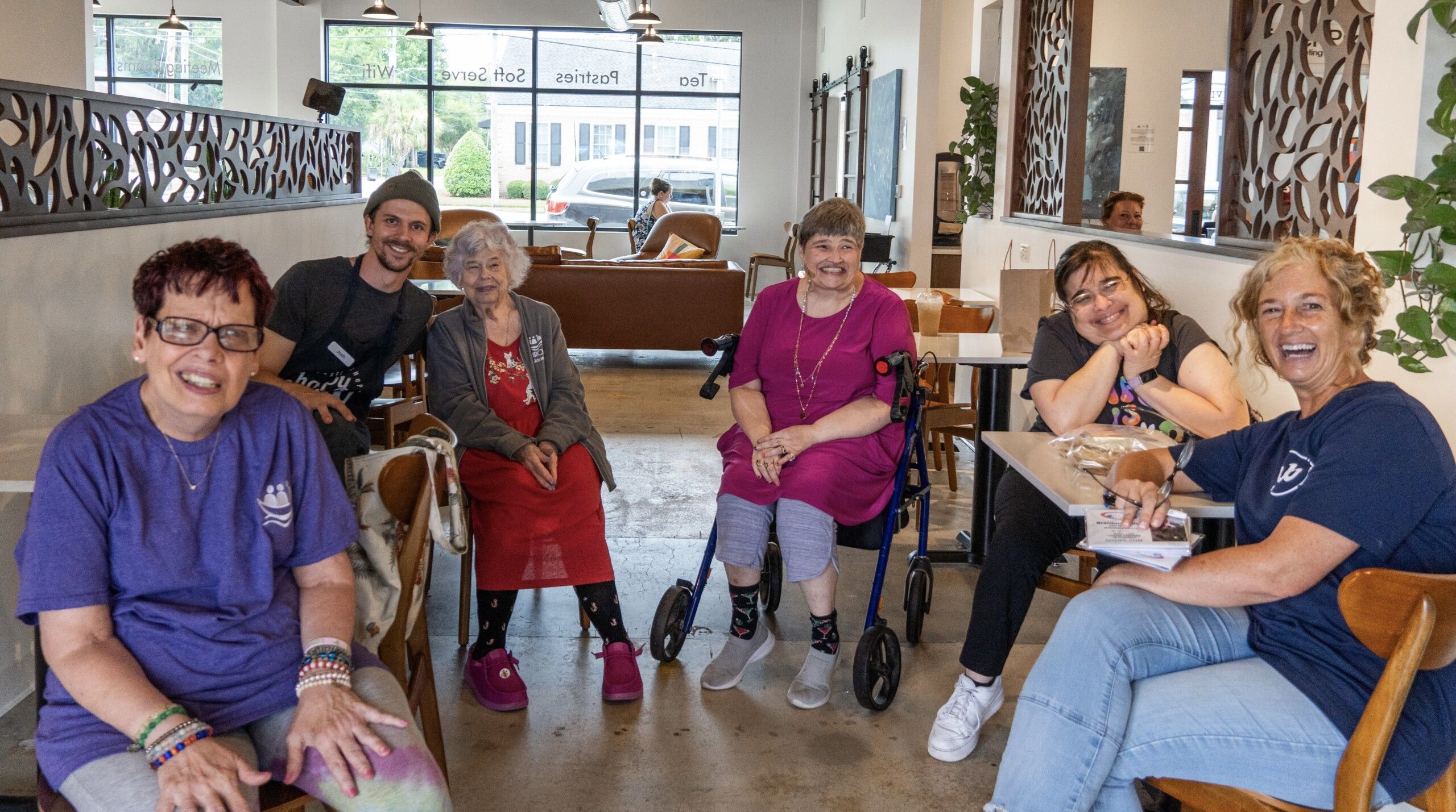core members posing for a photo with friends at Happy Brew